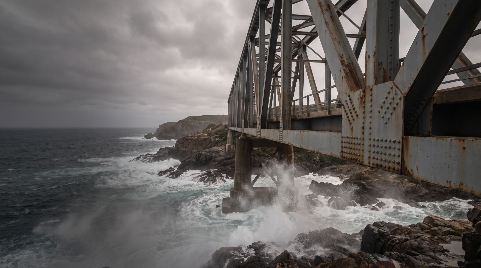 Corroded steel bridge on an exposed coastline